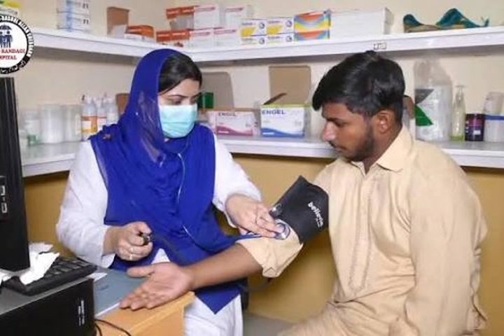 A health worker attending to a patient at the free community dispensary